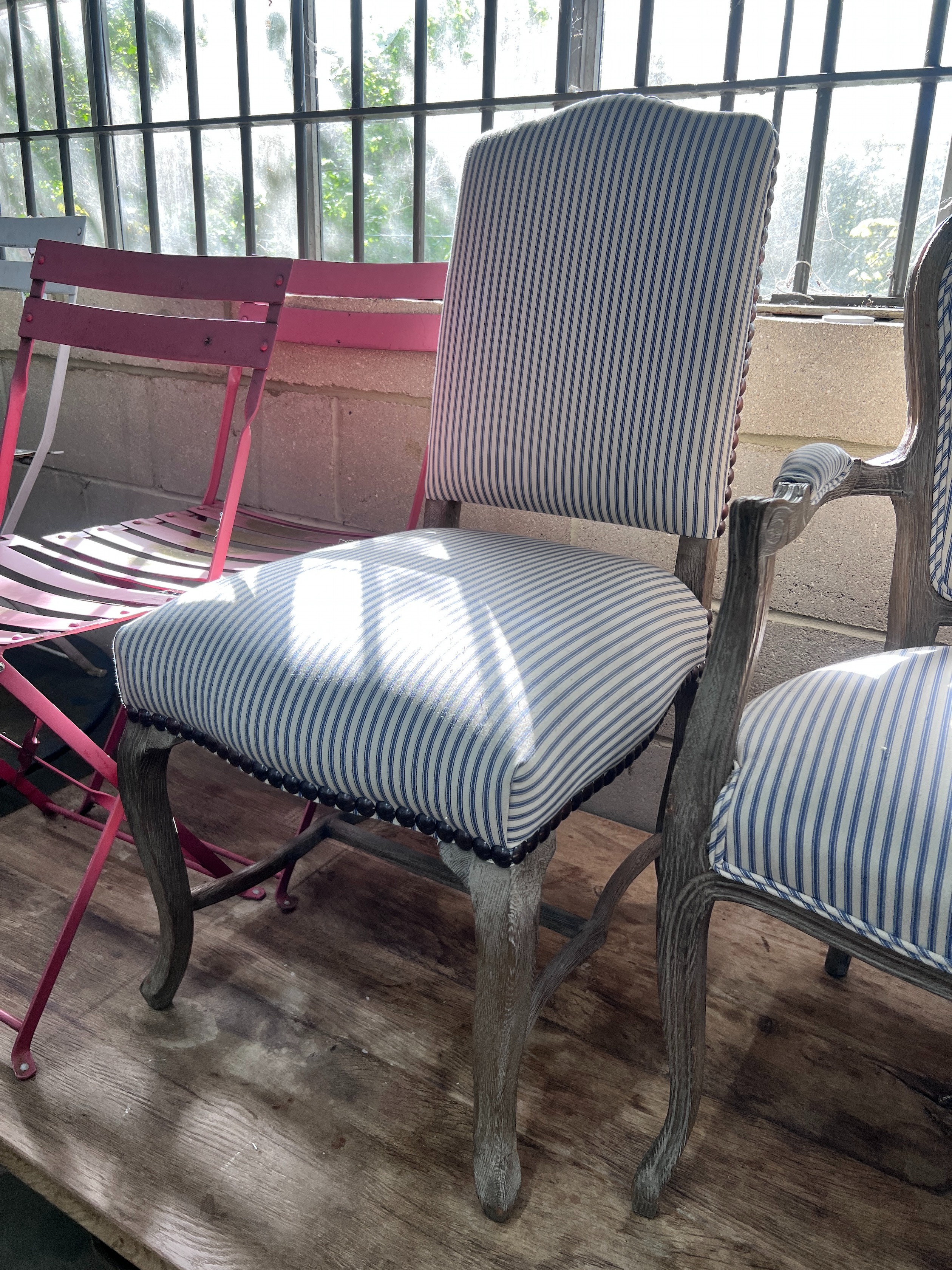 Two French style limed oak chairs, one with arms *Please note the sale commences at 9am.